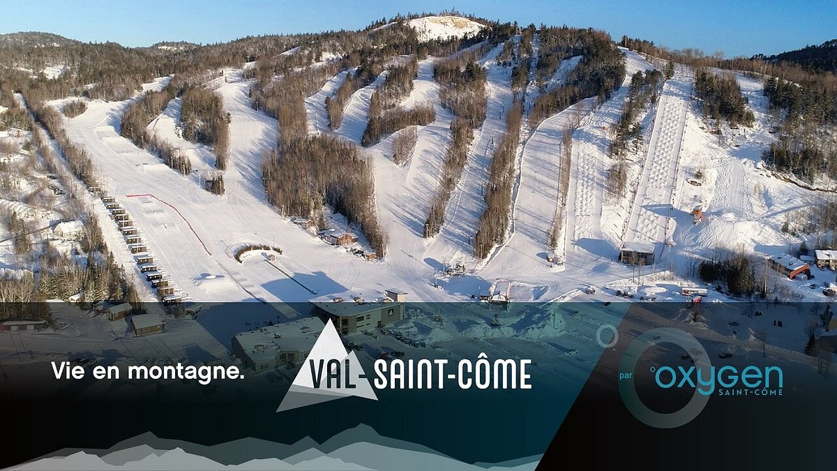 Val Saint-Come in Canada: an aerial view of a ski resort in the mountains.