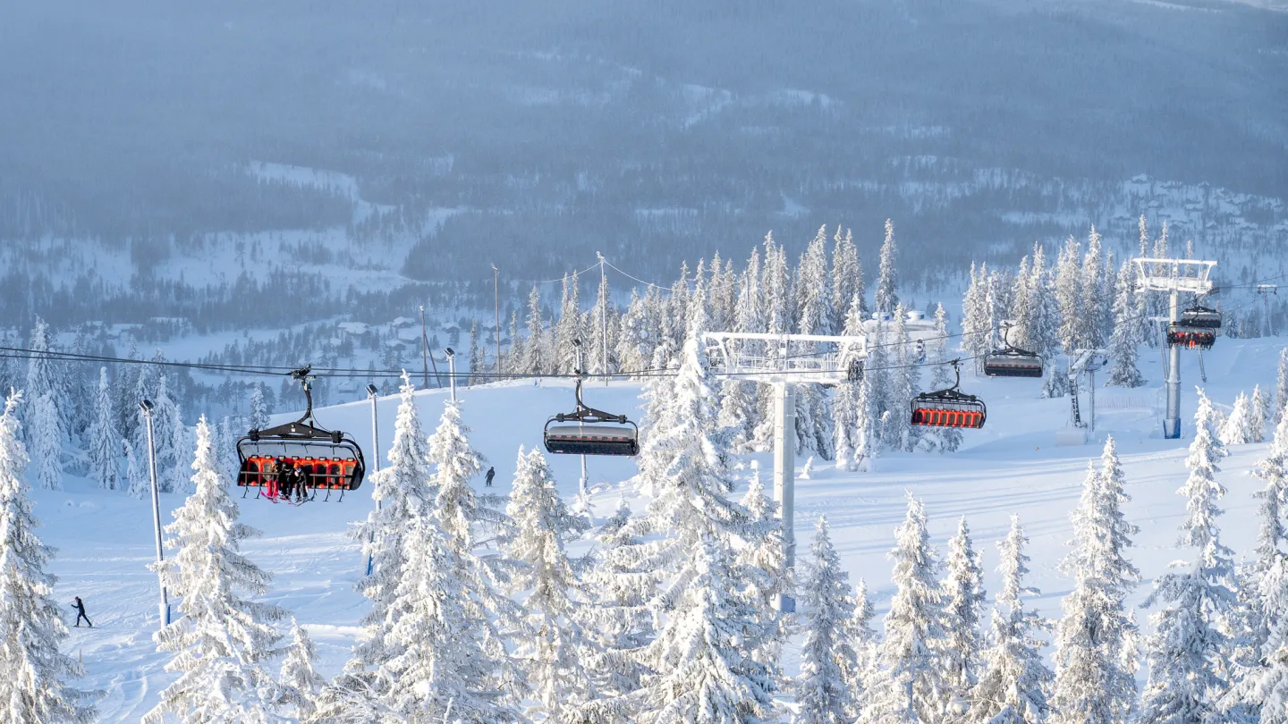 Nesfjellet – Nesbyen in Norway - a ski lift going up a snowy mountain.