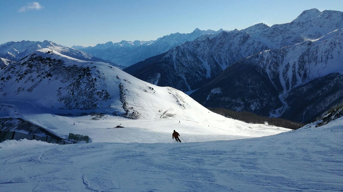 Crévacol in Italy - a person skiing down a snow covered mountain.