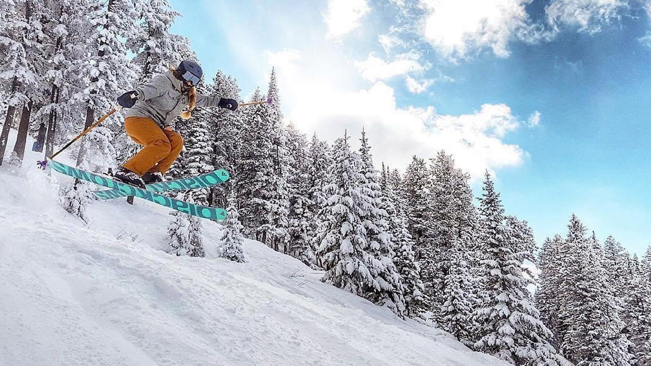 Pebble Creek in USA - a person jumping in the air on a snowboard.