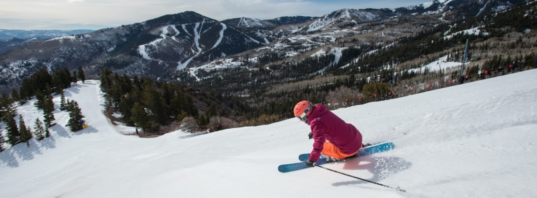 Butternut in USA - a person riding a snowboard down a snow covered slope.