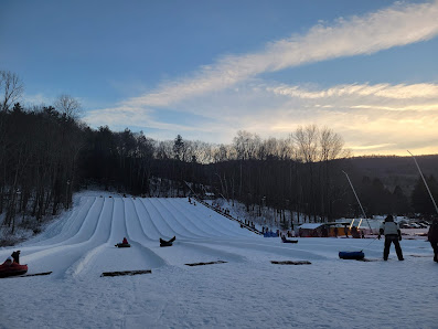 Winter sports enthusiasts enjoying a day at the Butternut ski resort in Great Barrington, Massachusetts. Snow-covered slopes and a picturesque winter scenery encapsulate the scene.