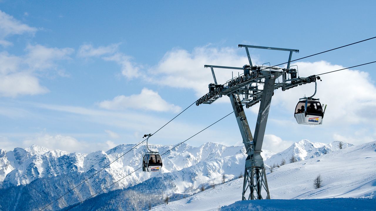 Obertilliach – Golzentipp in Austria - a ski lift going up the side of a mountain.