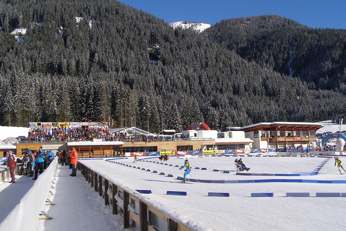 Obertilliach – Golzentipp in Austria - a group of people skiing down a snowy slope.