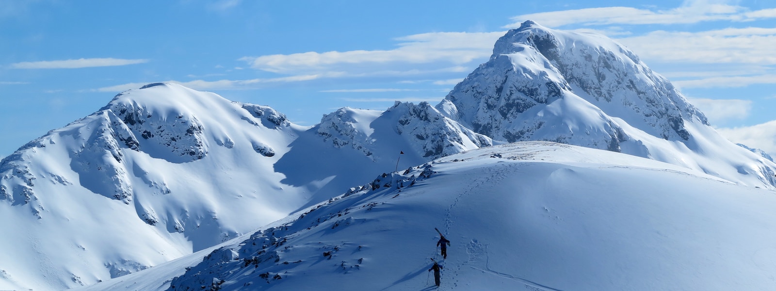 Cerro Bayo in Argentina - a person standing on top of a snow covered mountain.