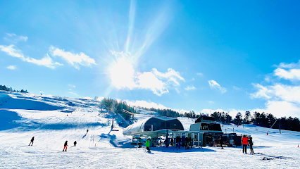 Winter scene at Gautefall Skisenter, Telemark, Norway featuring a ski resort amidst stunning snow-covered landscape, indicative of a thriving winter sports culture.