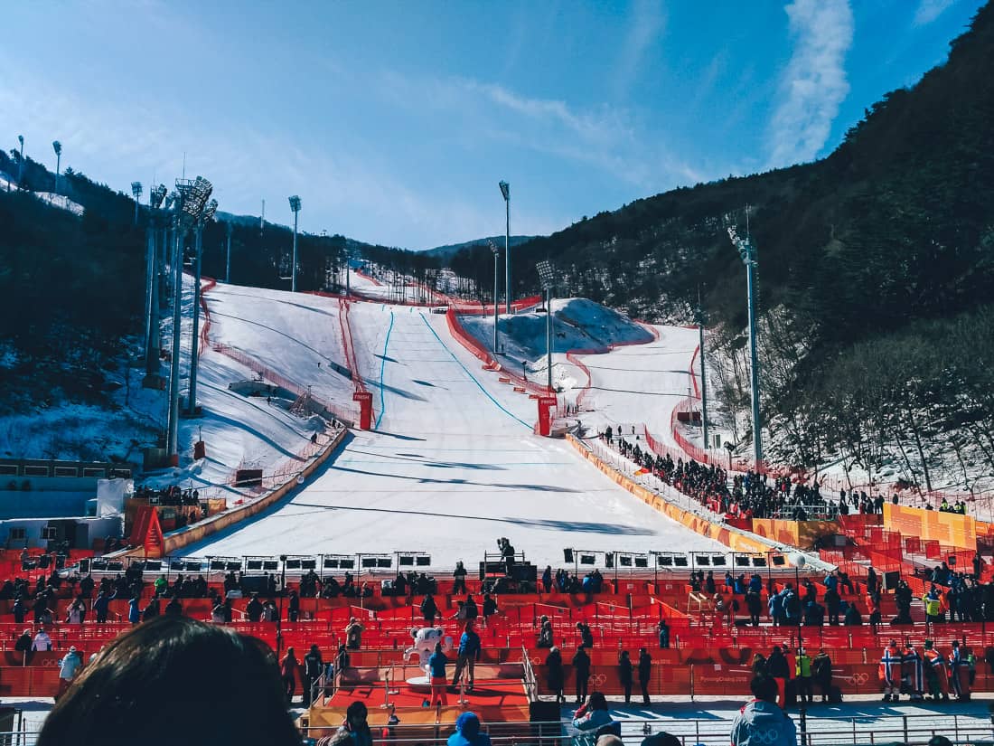 Jisan Forest Resort in South Korea - a crowd of people standing around a ski slope.