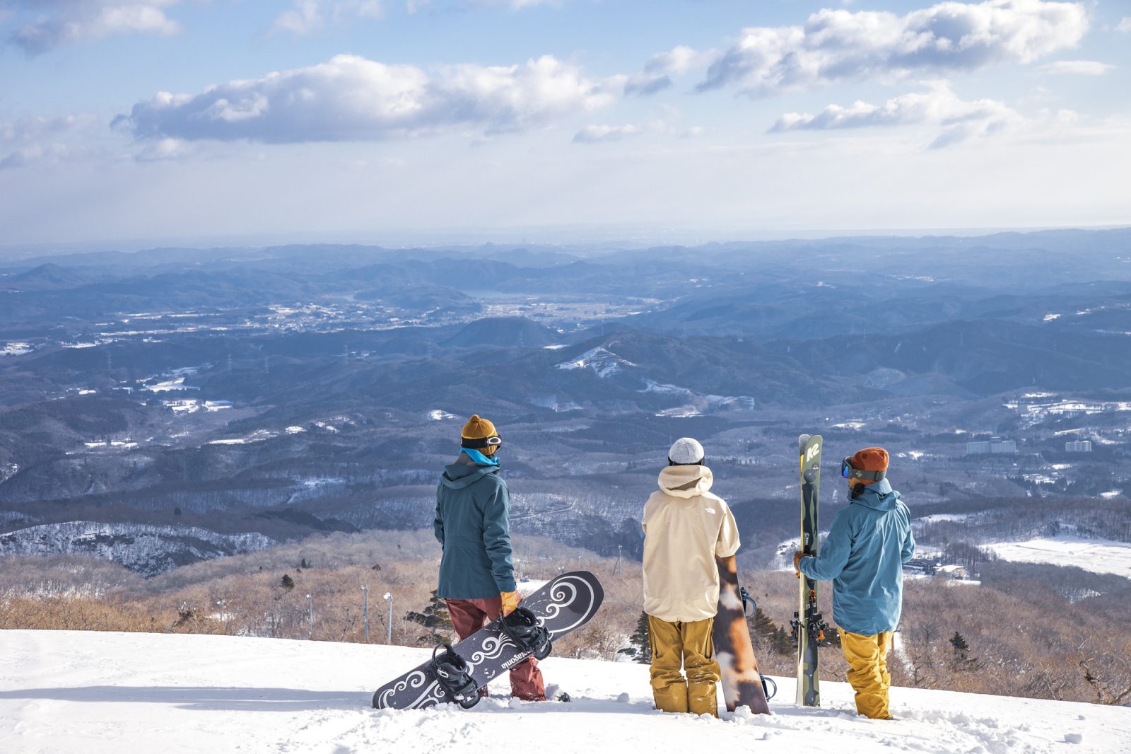 Miyagi Zao Eboshi Resort in Japan - three people standing on top of a snow covered mountain.