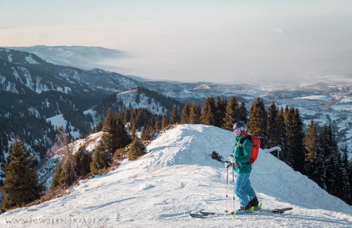 Ak Bulak in Kazakhstan - a person skiing down a snowy mountain.