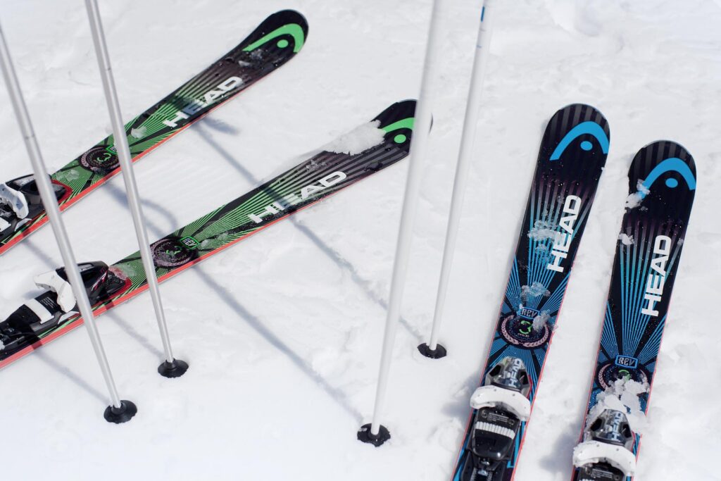 A family enjoying skiing at Camp Fortune in Quebec, Canada. The winter sports scene is vibrant with pristine snowy slopes at the bustling ski resort.