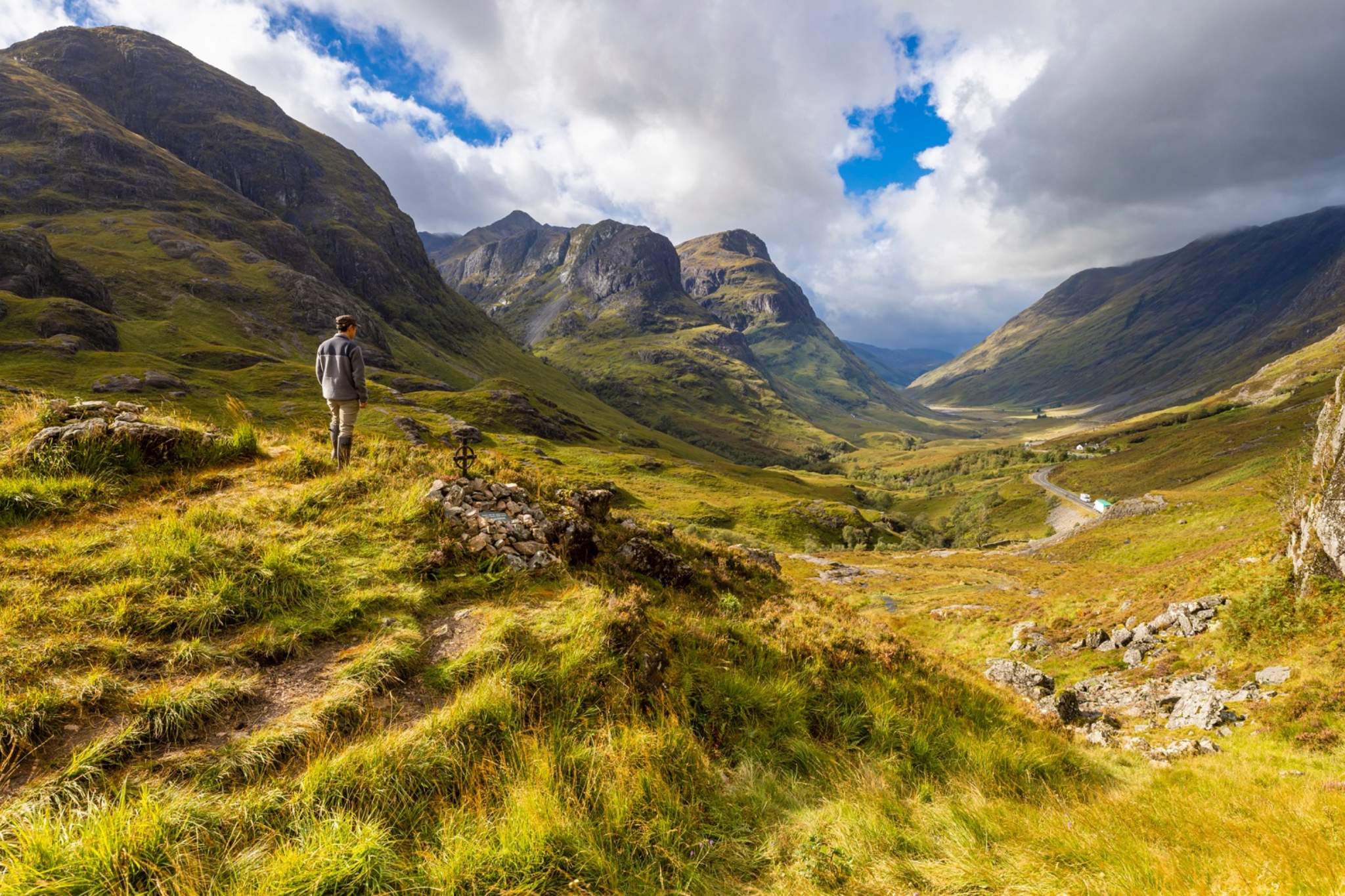 Glencoe Mountain in United Kingdom - a man standing on the side of a mountain.