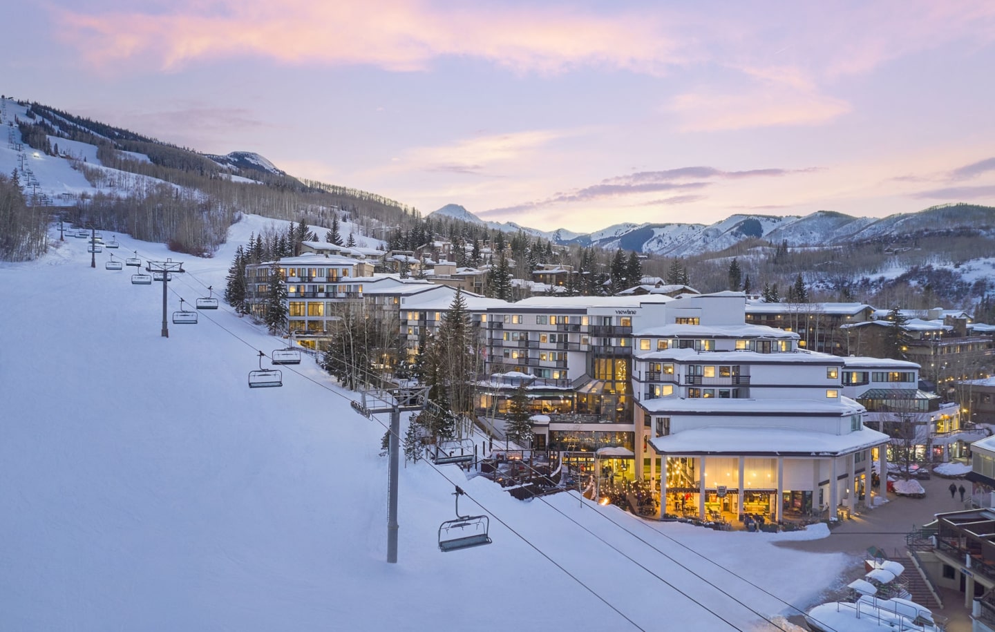 Aspen Snowmass in USA: a ski resort in the mountains at dusk.
