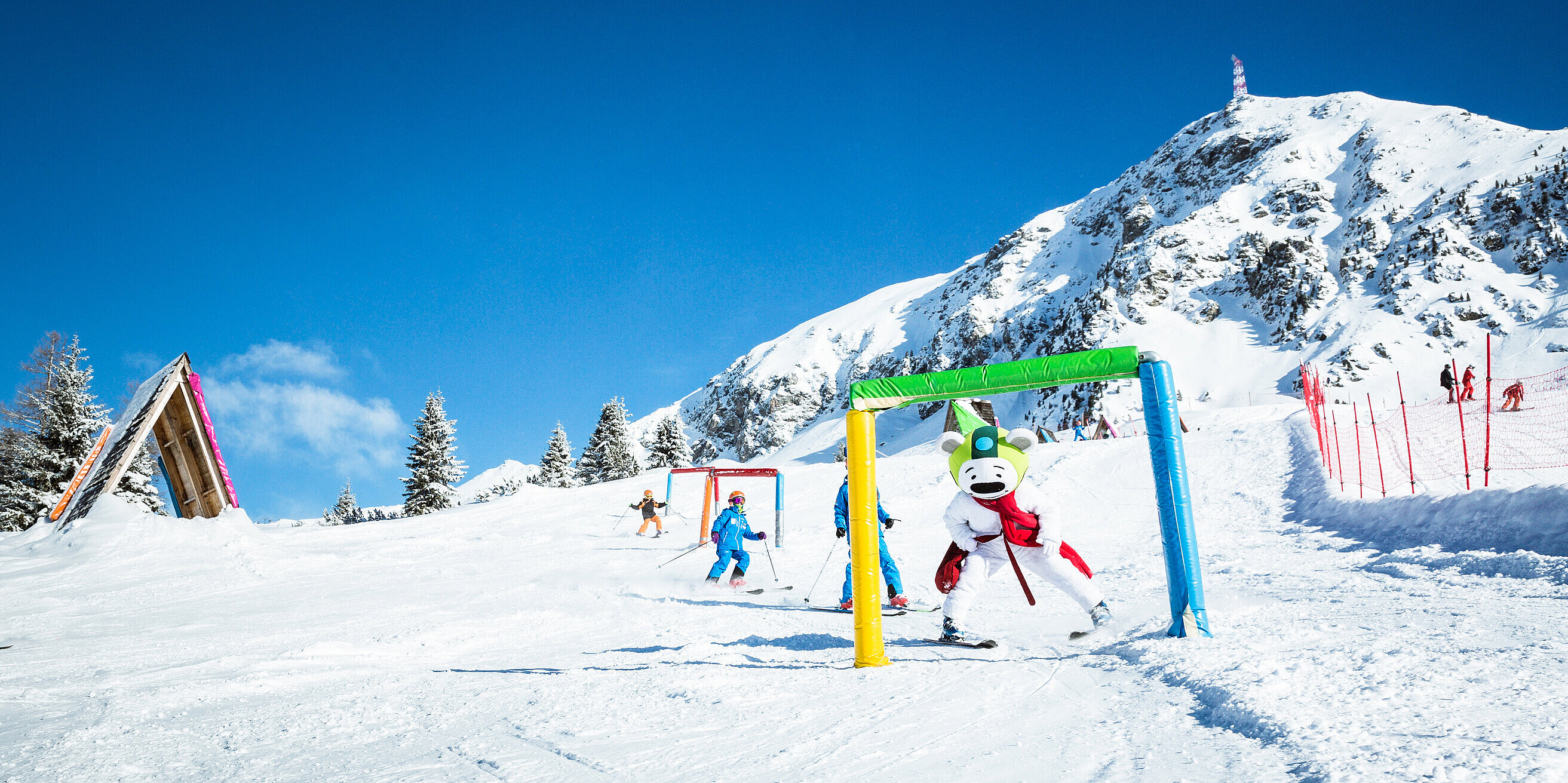 A bustling winter sports scene in Obertauern Lungau Salzburg Austria featuring a ski resort with a ski lift inviting skiers to enjoy the pristine snowy slopes.