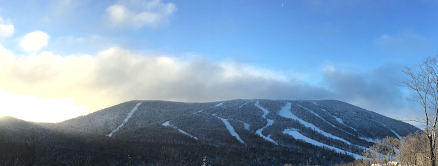 Snow covering the beautiful mountain slopes at Massif du Sud in Quebec Canada. Winter sports enthusiasts thrive at this popular ski resort amongst the stunning natural scenes.