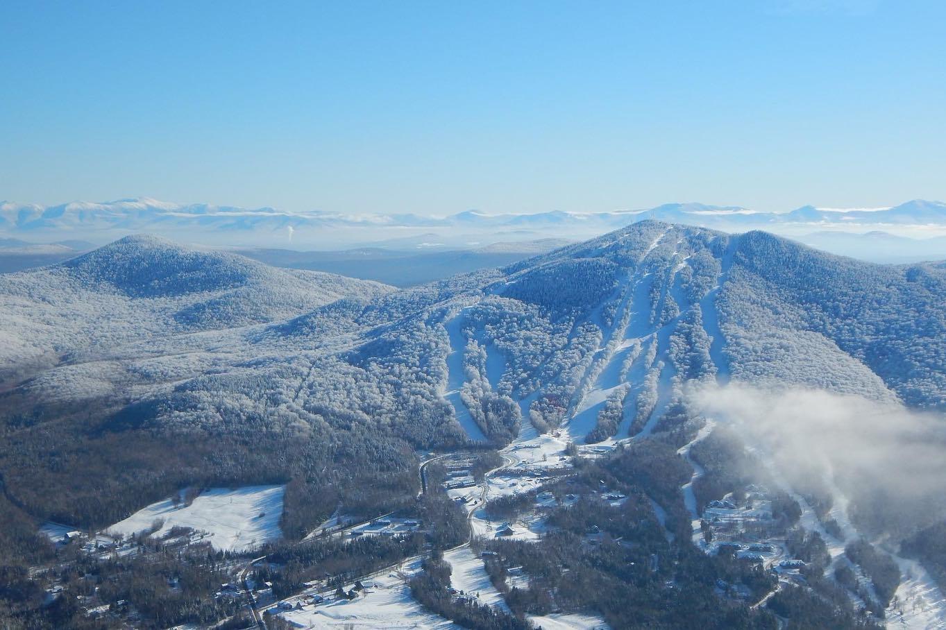 Burke Mountain in USA - a view from the top of a snowy mountain.
