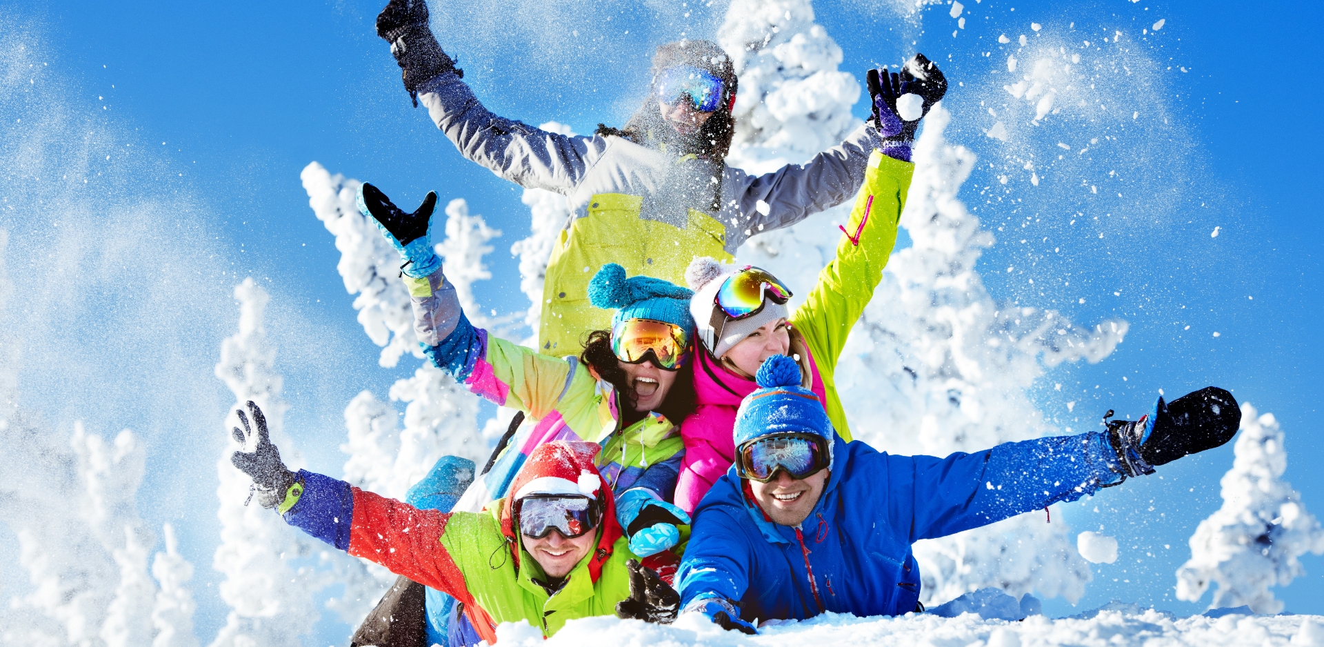 Winter sports scene at the Yunomaru ski resort in Nagano, Japan, featuring multiple people engaging in skiing activities amidst the snow-covered landscape.