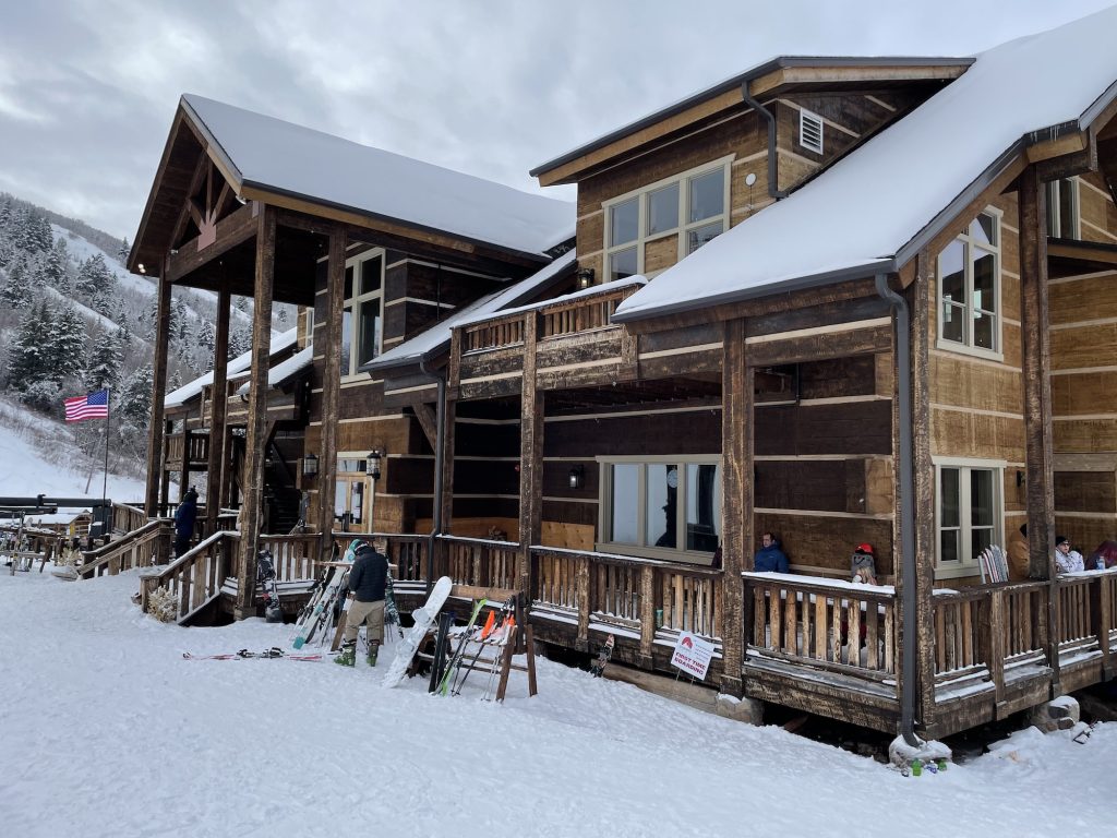 Cherry Peak in USA - a wooden house with snow on the roof.