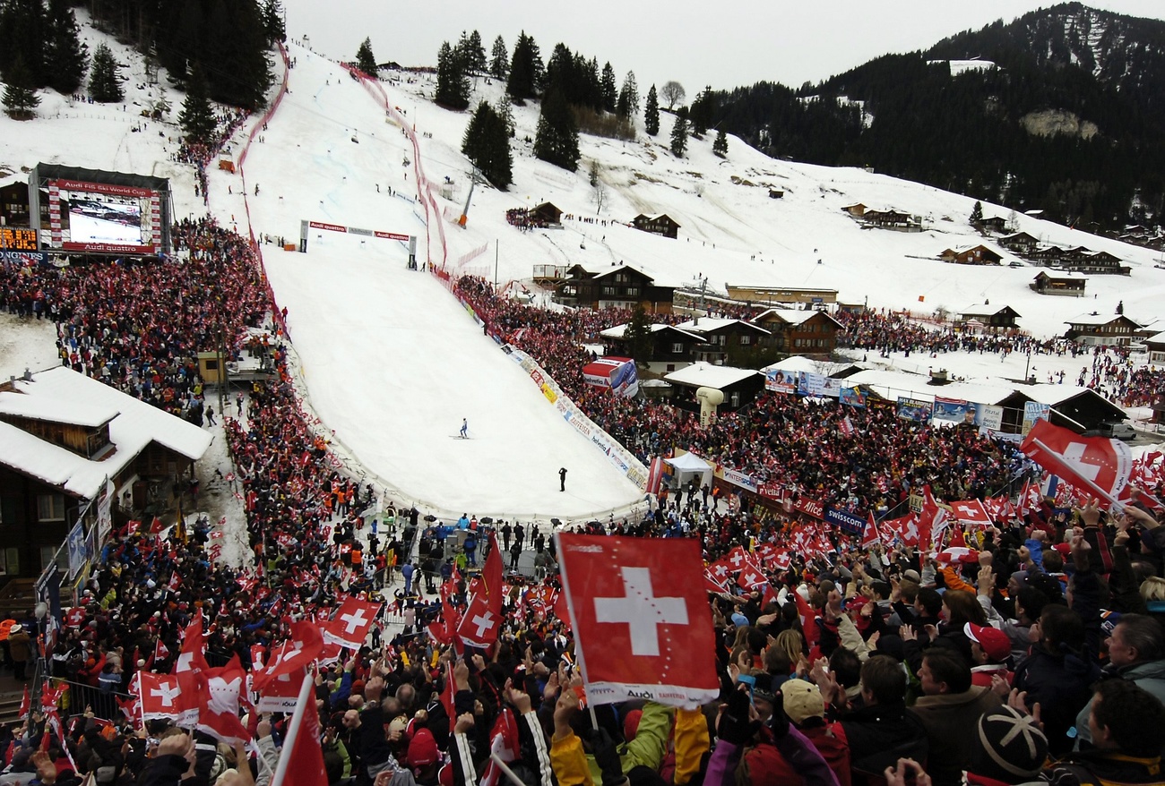 Adelboden | ​Lenk – Chuenisbärgli | ​Silleren | ​Hahnenmoos | ​Metsch in Switzerland - a large crowd of people are gathered in the snow.