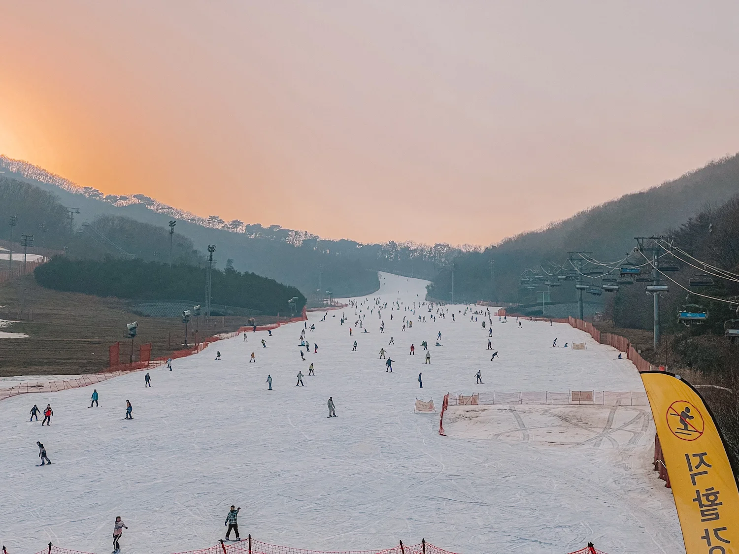 Konjiam Resort in South Korea - a group of people skiing down a snowy slope.
