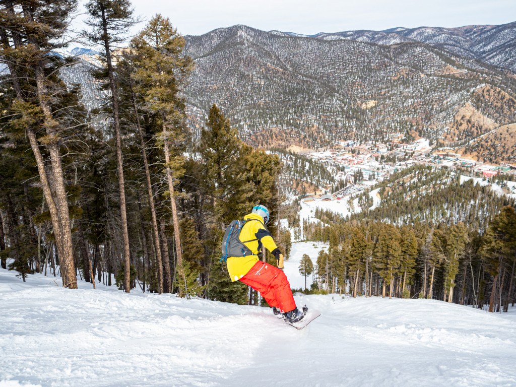 Red River in USA - a person on a snowboard going down a hill.