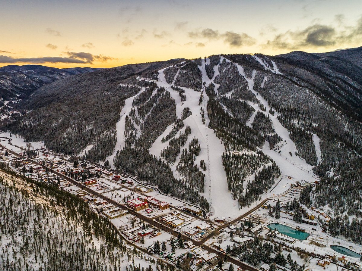Red River in USA: a ski resort in the mountains at sunset.