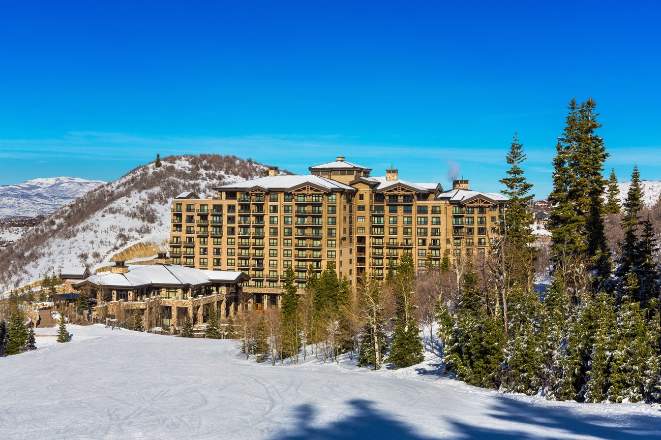 Deer Valley in USA: a ski resort in the mountains surrounded by trees.