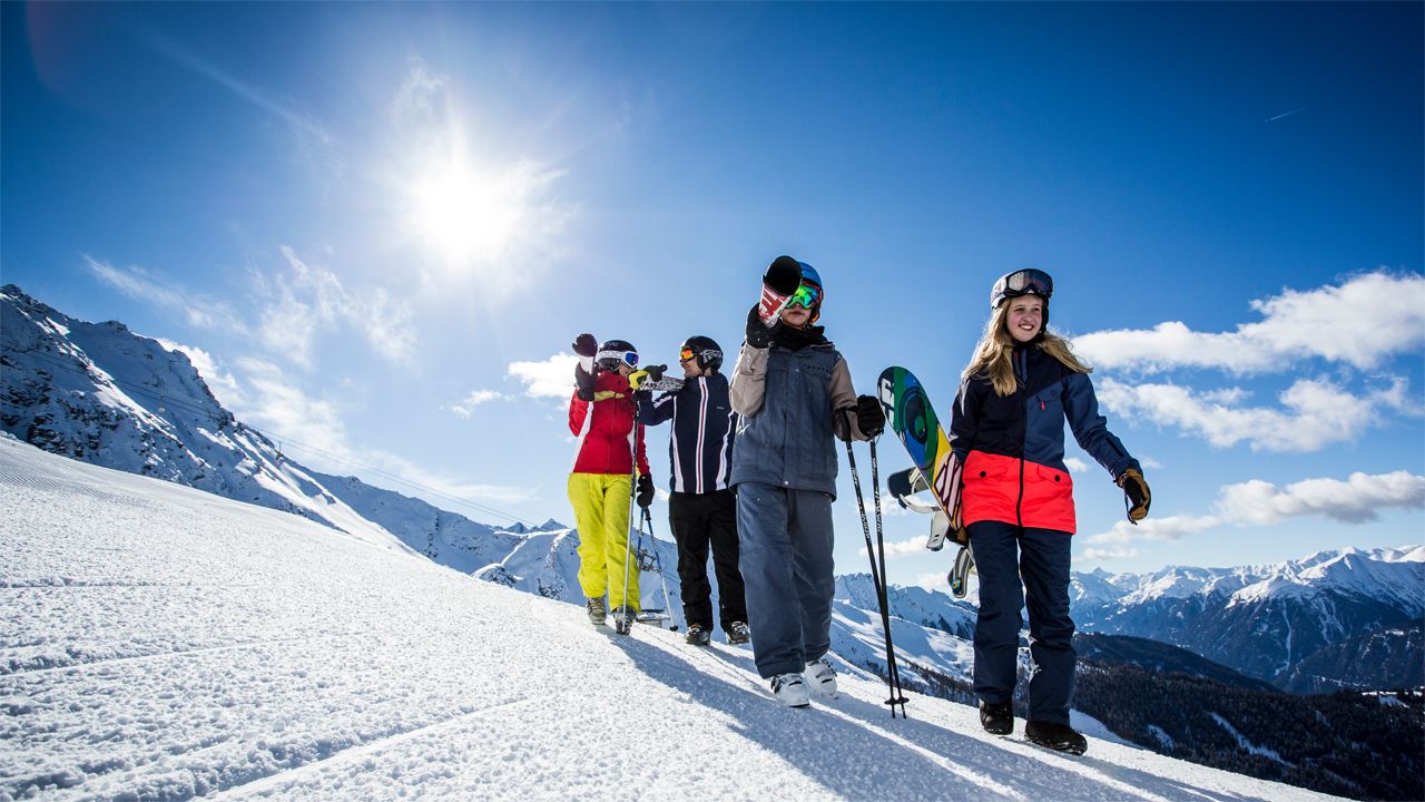 Fendels in Austria - a group of people walking up a snow covered mountain.