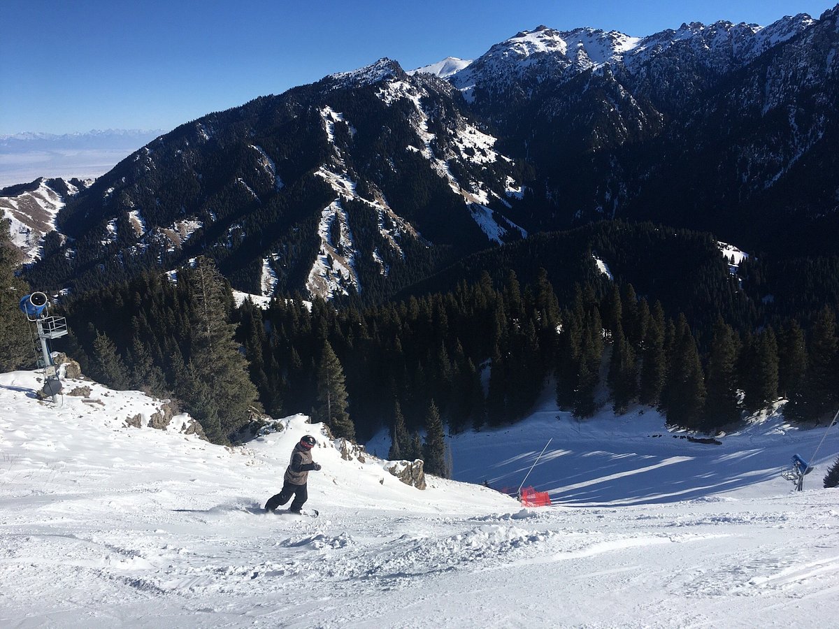 SilkRoad Ski in China - a person on a snowboard in the snow.