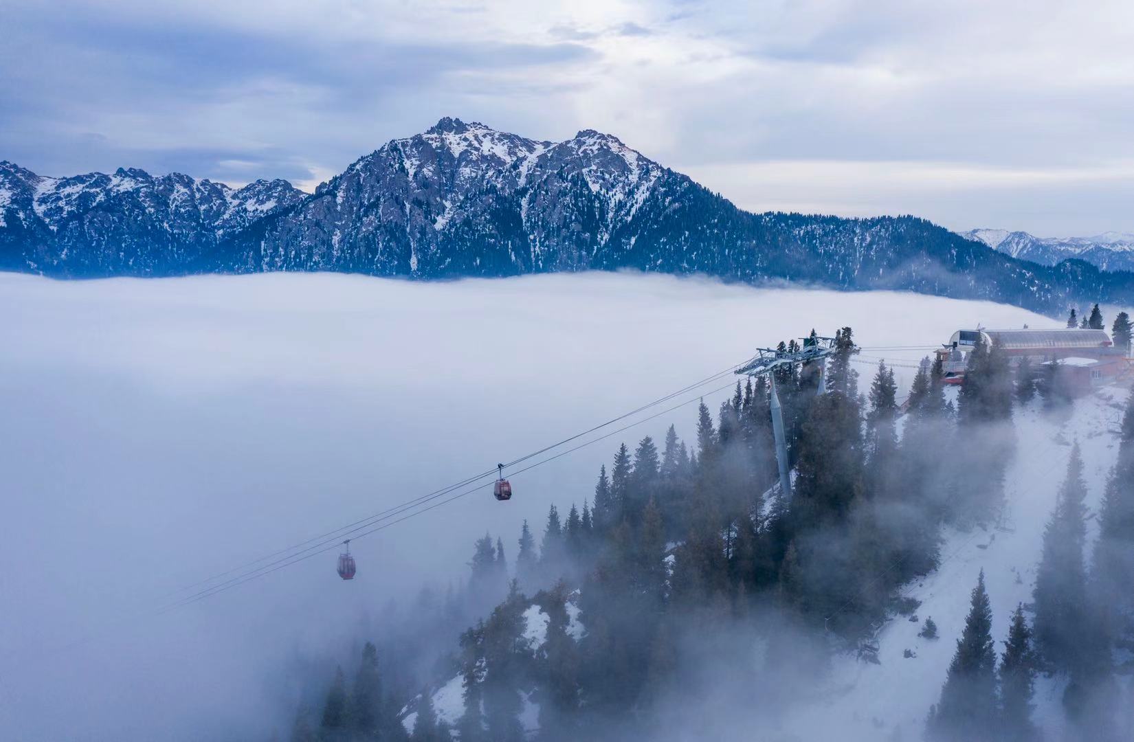 SilkRoad Ski in China - a cable car in the middle of a snowy mountain.