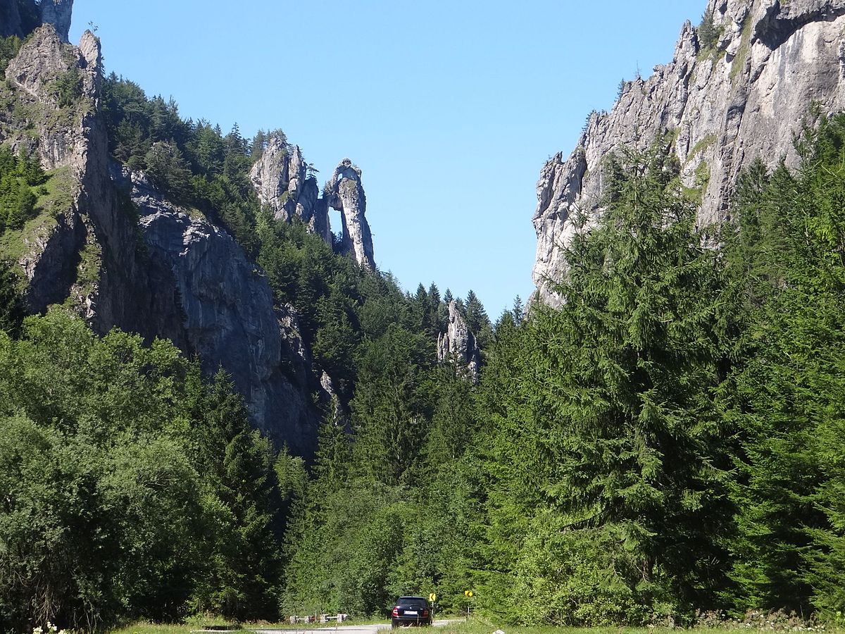 Vrátna in Slovakia - a car driving down a road in front of a mountain.