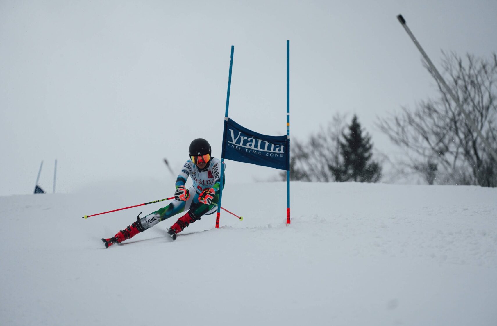 Vrátna in Slovakia - a person skiing down a hill with a flag.