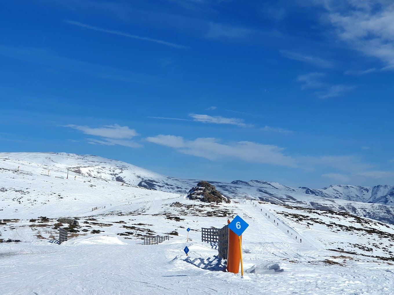 Stara Planina in Serbia - a blue sign sitting on top of a snow covered mountain.