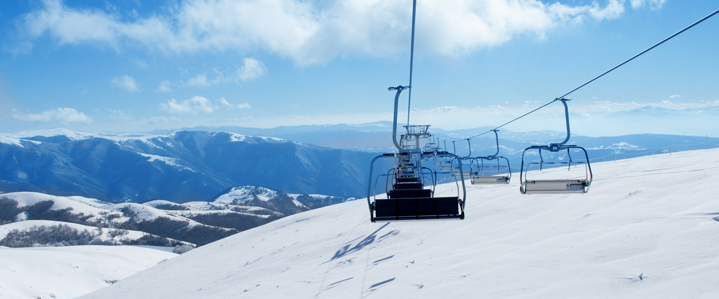 Stara Planina in Serbia - a ski lift going up a snowy mountain.