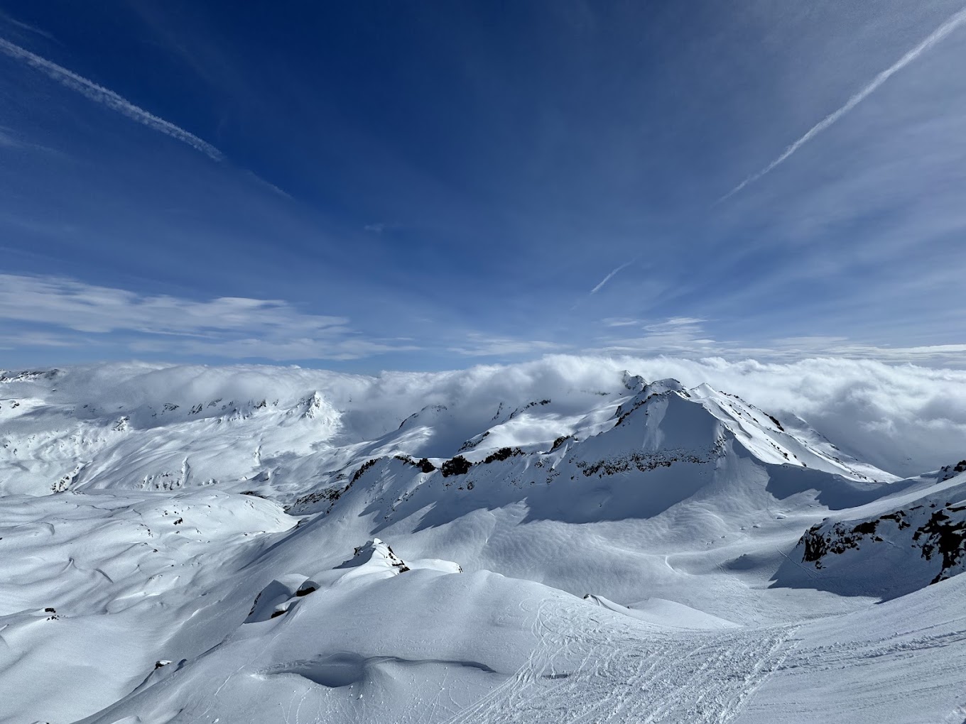 Andermatt ​Sedrun Disentis in Switzerland - the view from the top of a snowy mountain.