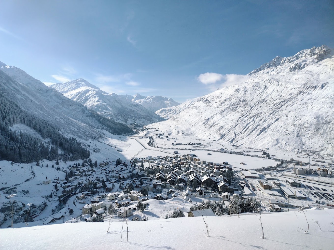Andermatt ​Sedrun Disentis in Switzerland - a snow covered village in the swiss alps.