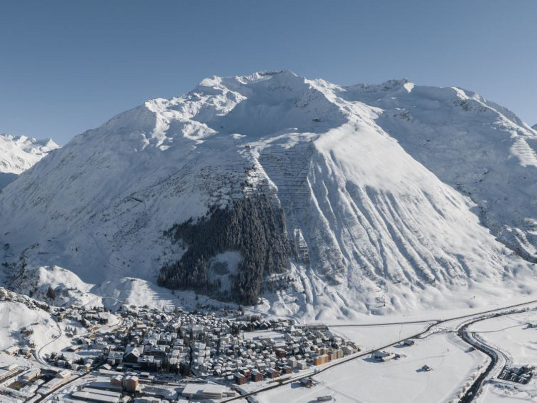Andermatt ​Sedrun Disentis in Switzerland - a snowy village in the swiss alps.