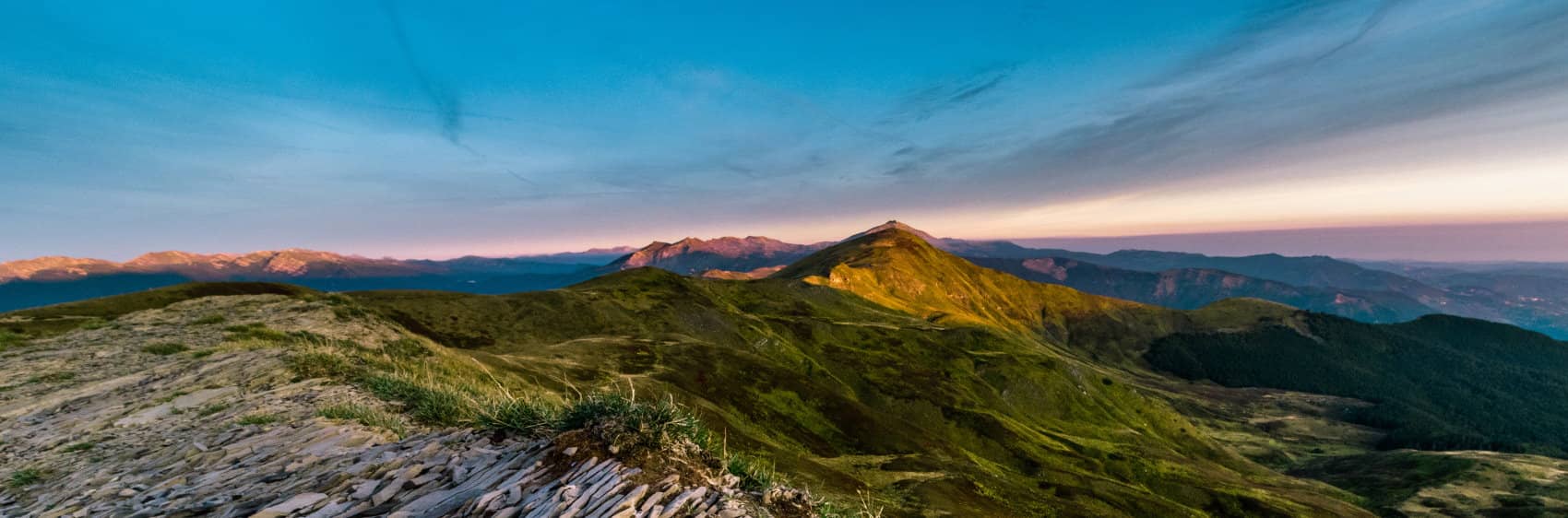 Corno alle Scale in Italy - a view from the top of a mountain at sunset.