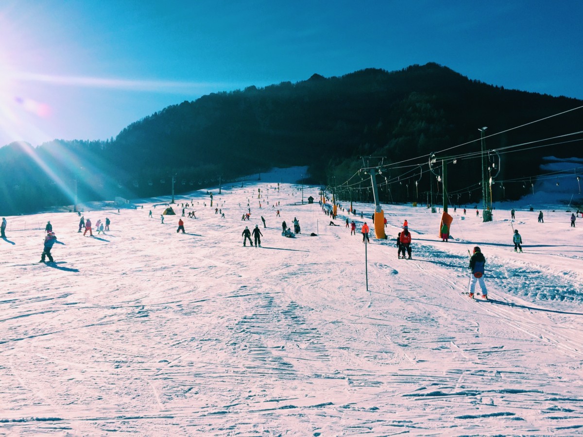 Kranjska Gora in Slovenia - a group of people skiing down a snowy slope.