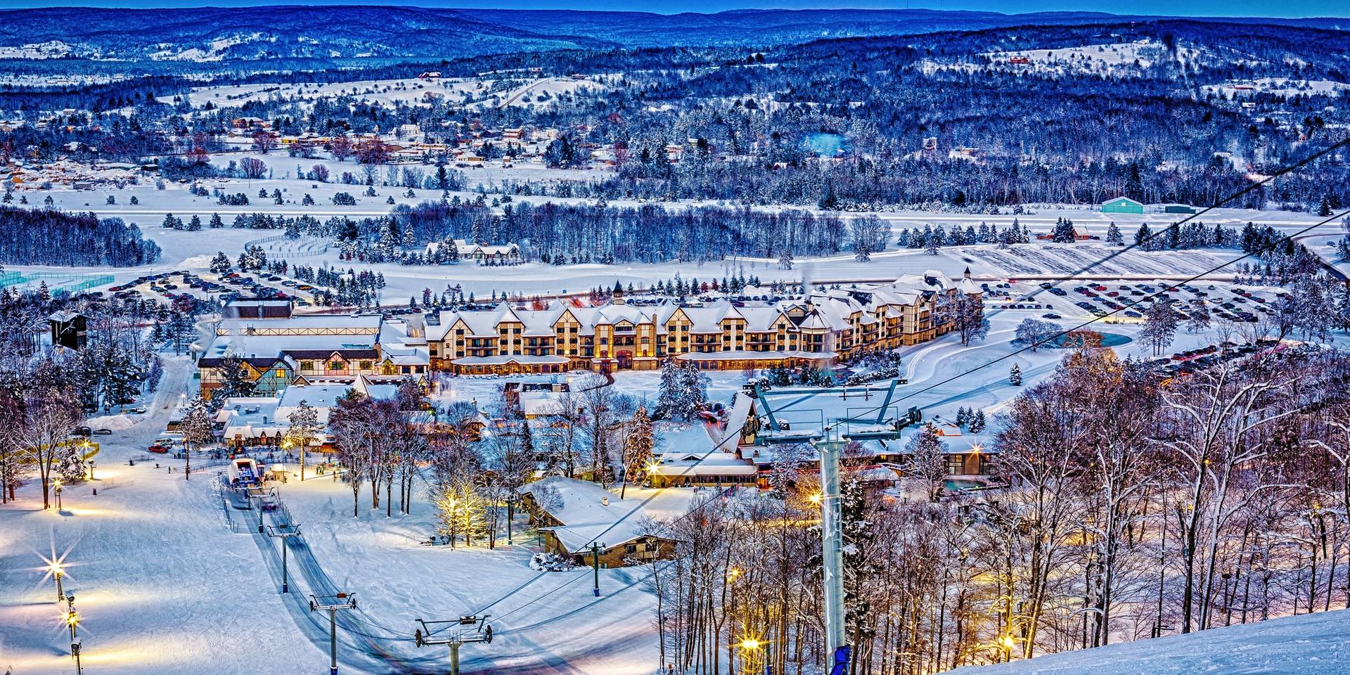 Boyne Mountain in USA: a ski resort in the mountains at night.