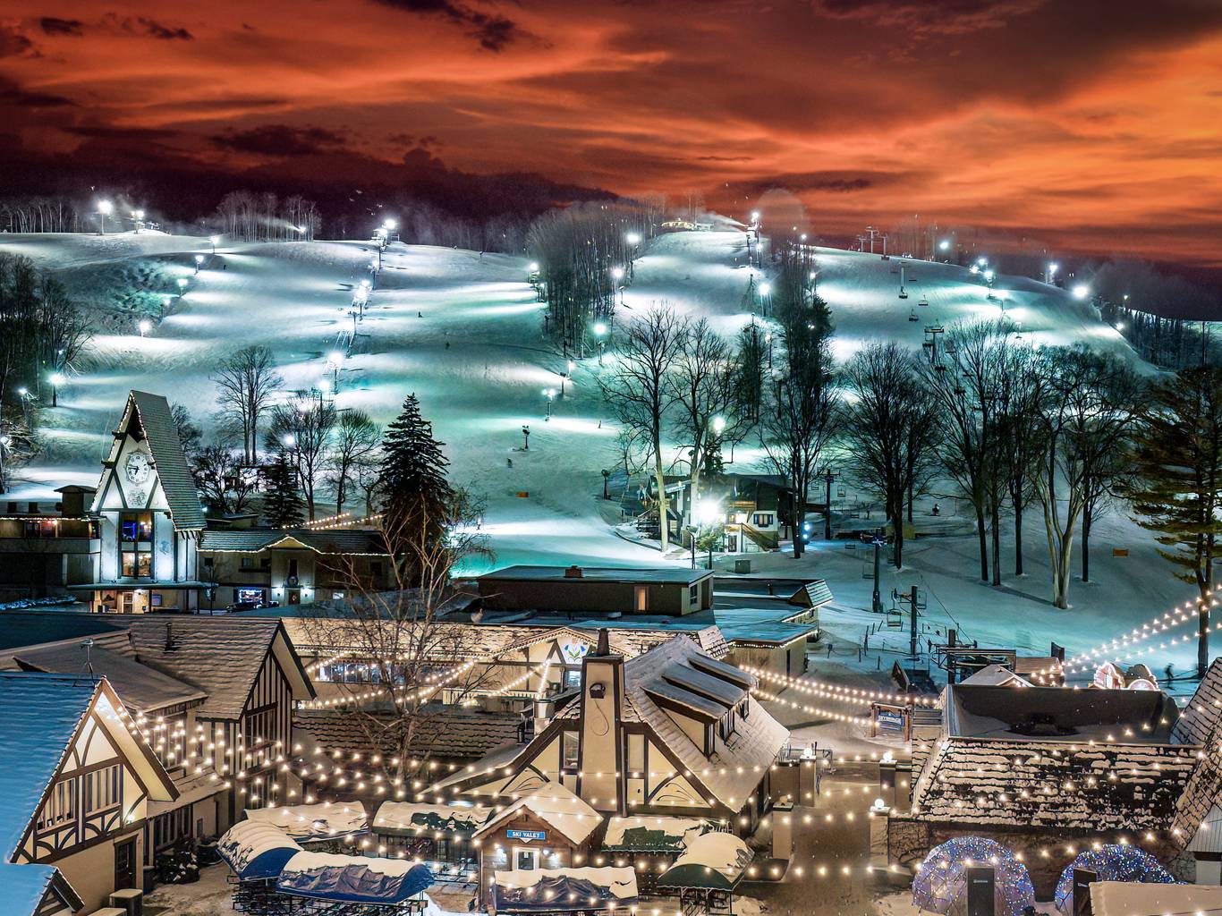 Boyne Mountain in USA: a ski resort lit up at night.