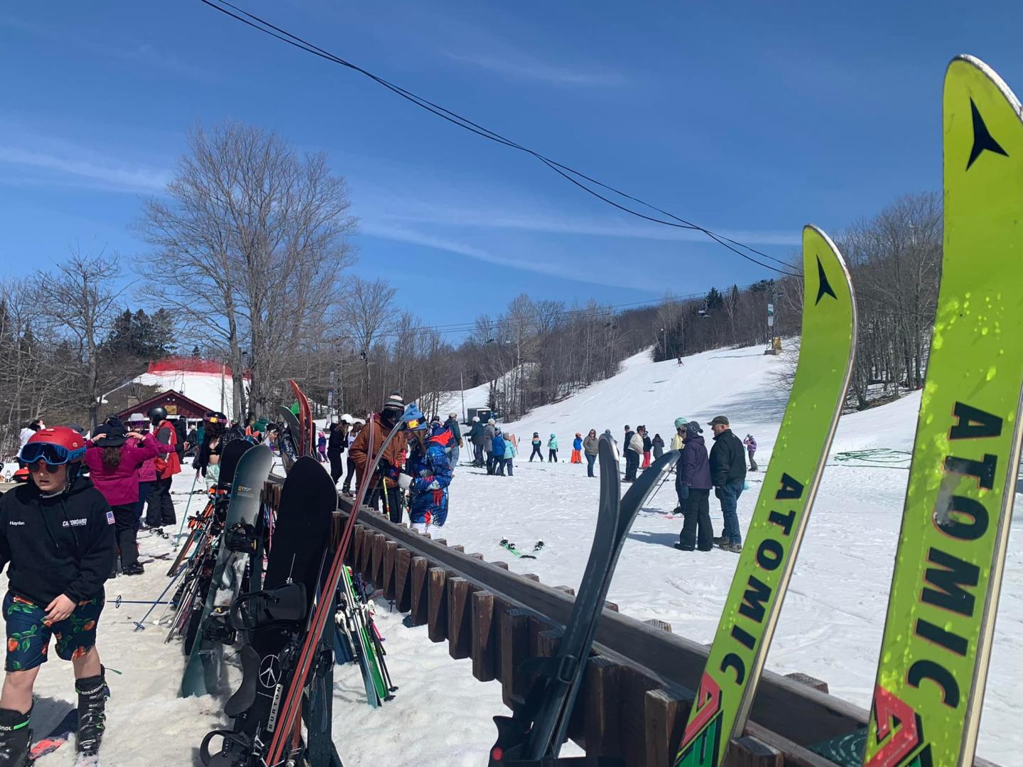 Bigrock Mountain in USA - a group of people standing on top of a snow covered slope.
