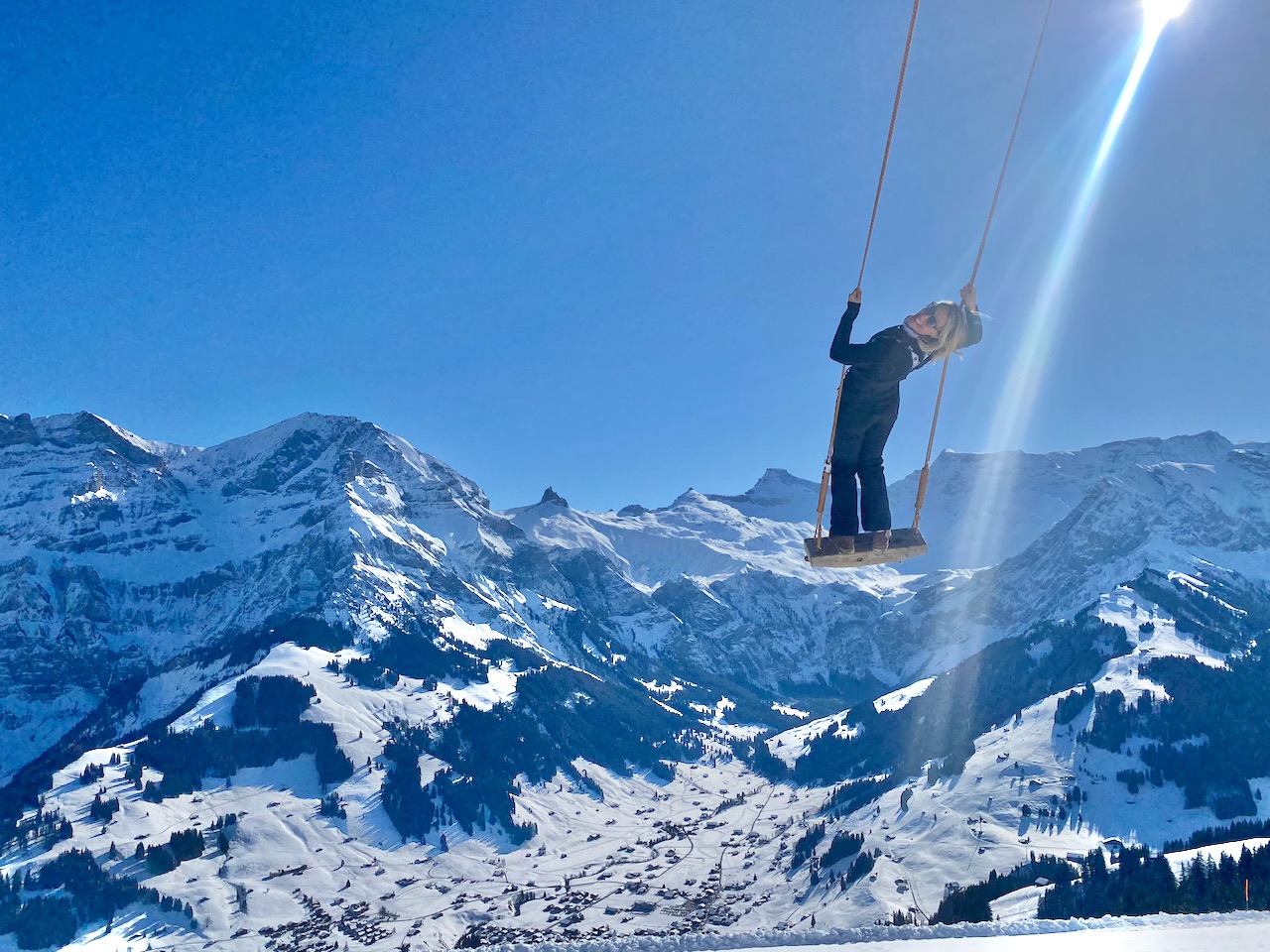Tschentenalp in Switzerland - a person on a snowboard in the mountains.