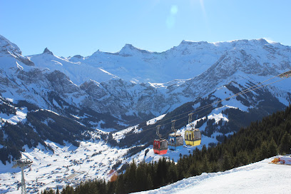 Ski chalet amidst a ski resort at Tschentenalp in Bern, Adelboden, Switzerland. The scene captures the essence of winter sports with its stunning winter scenery.