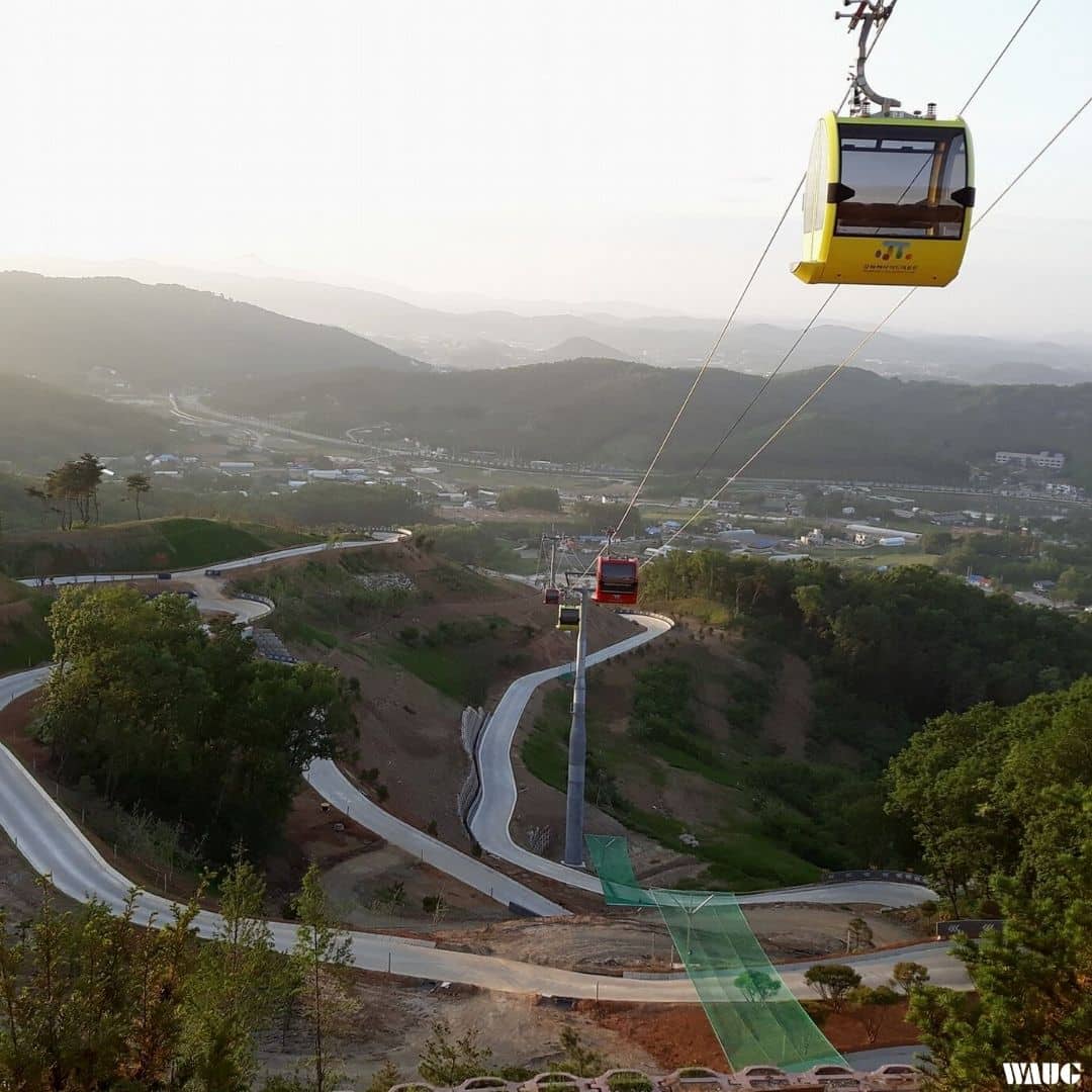 Ganghwa Seaside Resort in South Korea - a cable car going up the side of a hill.