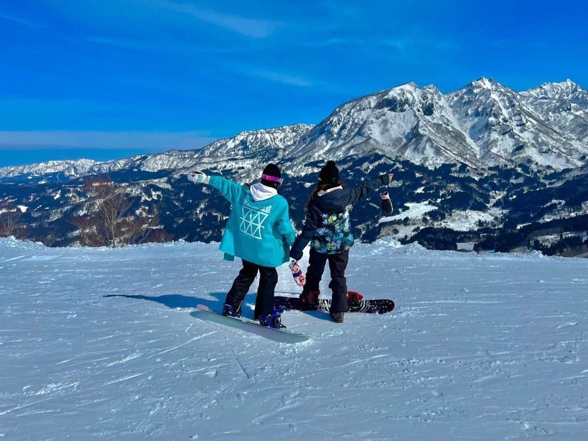 Itoigawa Seaside Valley in Japan - two snowboarders in the snow.