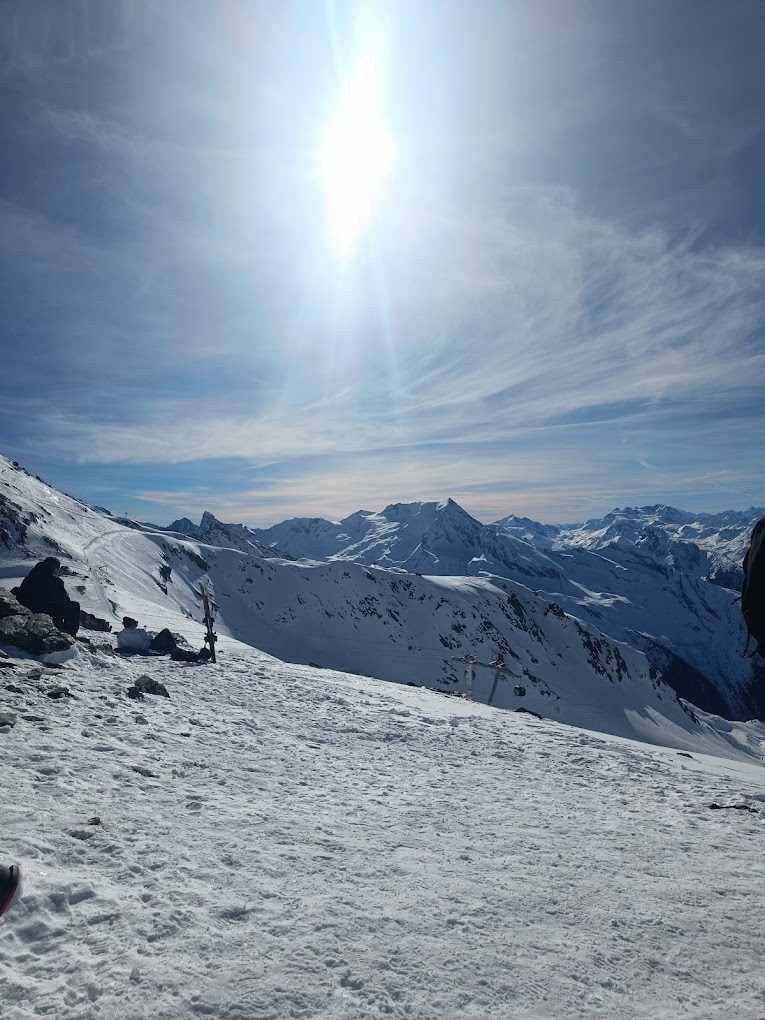La Plagne in France - a person standing on top of a snow covered mountain.