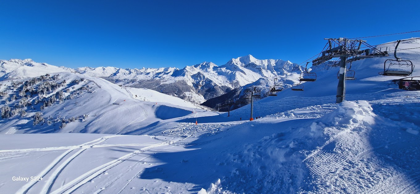 La Plagne in France - a ski lift going up a snowy mountain.