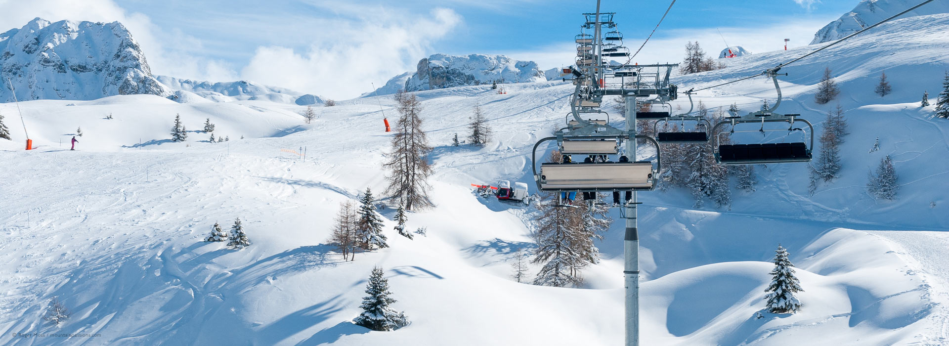 La Plagne in France - a ski lift going up a snowy mountain.