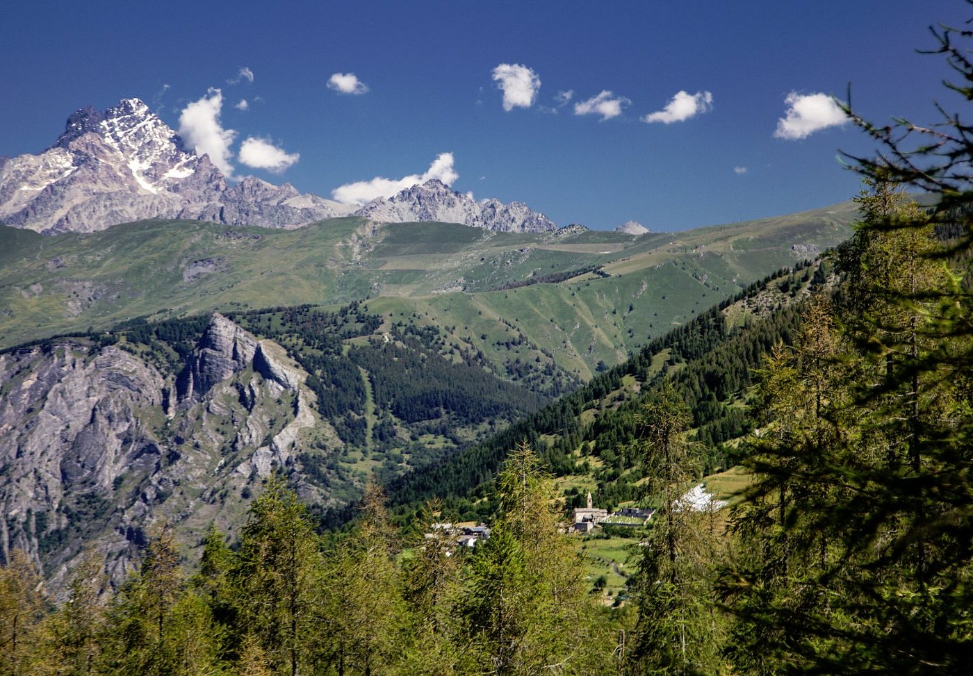 Sampeyre in Italy - a view of the mountains from the top of a mountain.