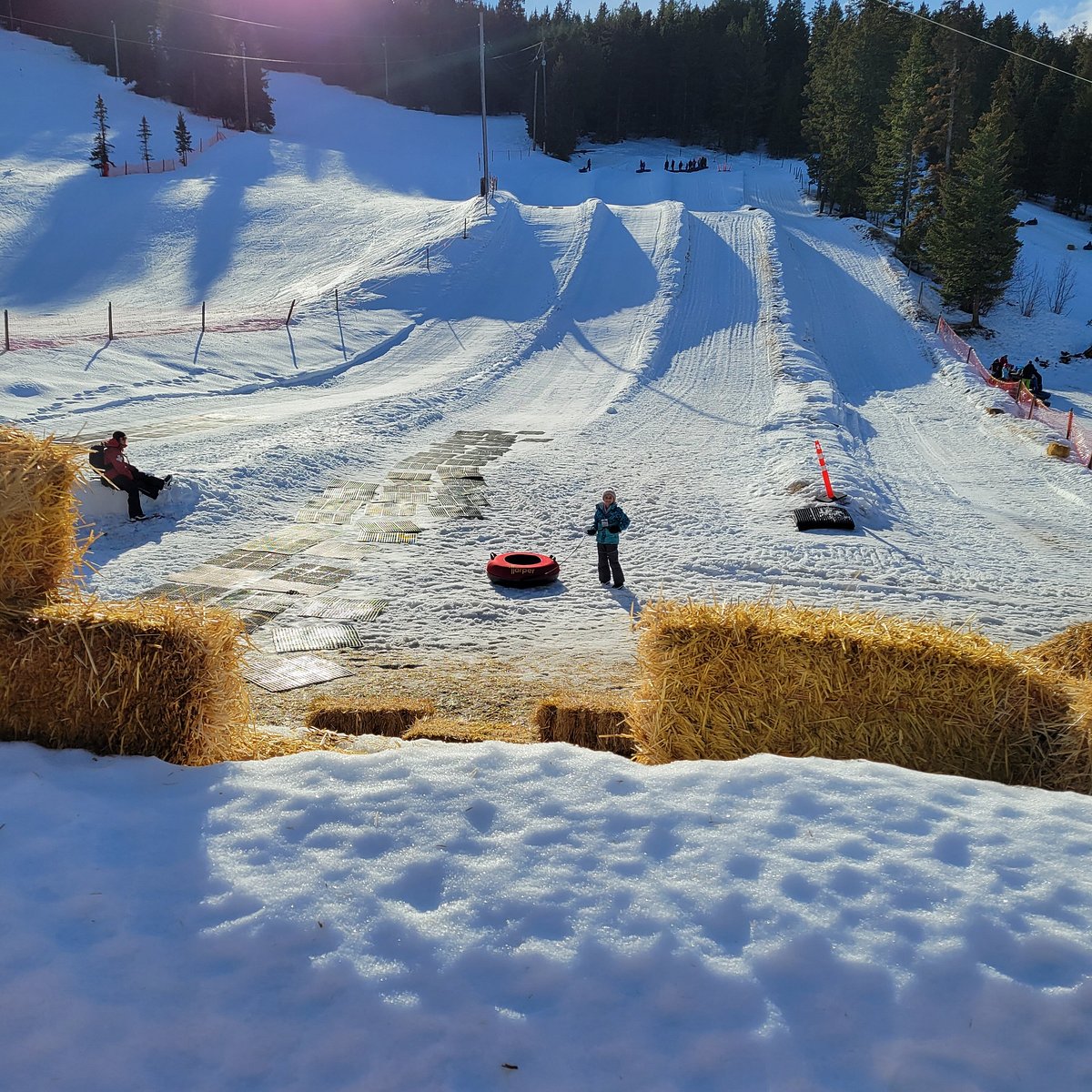 Harper Mountain in Canada - a group of people skiing down a snowy hill.